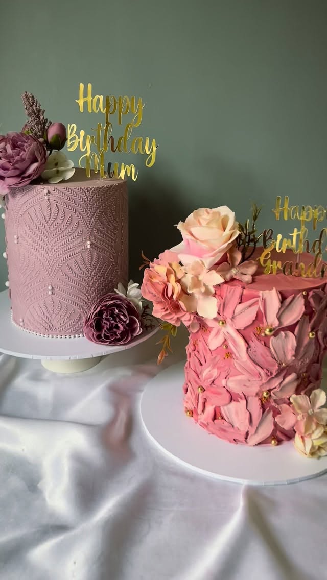 Two pink celebration cakes with fresh flowers and Happy Birthday Mum and Grandma toppers